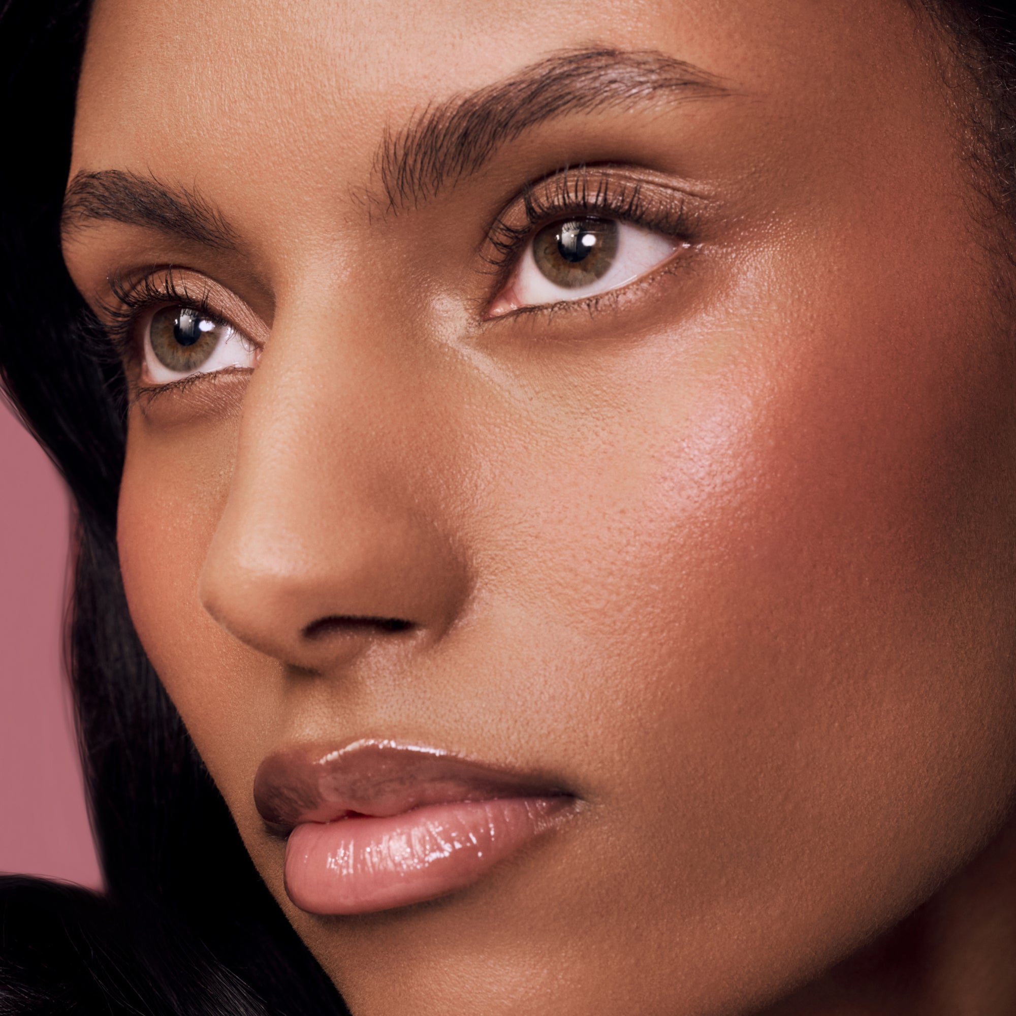 Close-up of a woman's face with a soft focus on her cheeks and lips.