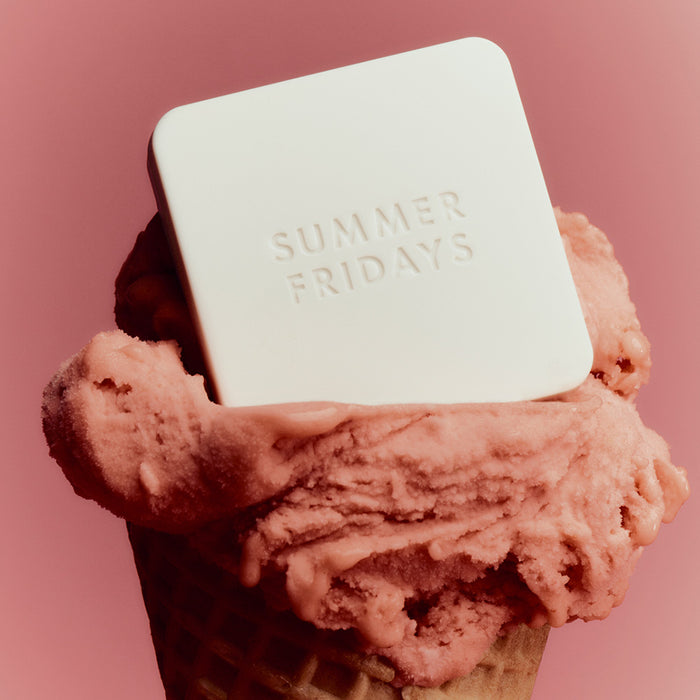 Pink ice cream cone with a 'Summer Fridays' Blush Butter Balm on top against a pink background
