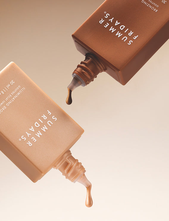 Two 'Summer Fridays' bronzing products on a textured brown surface