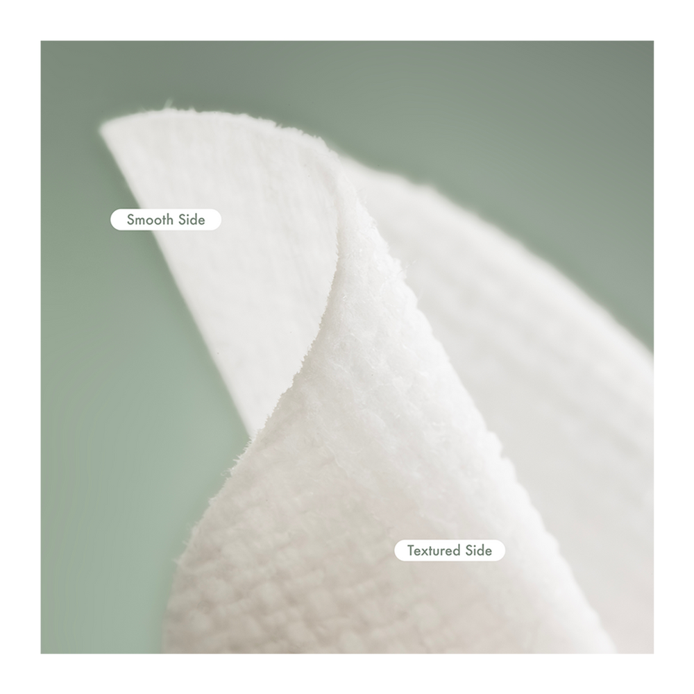 Cotton pad showing smooth and textured sides on a green background