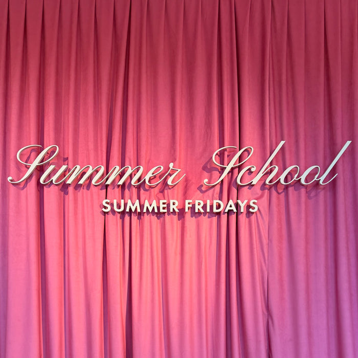 Pink curtain with 'Summer School Summer Fridays' text