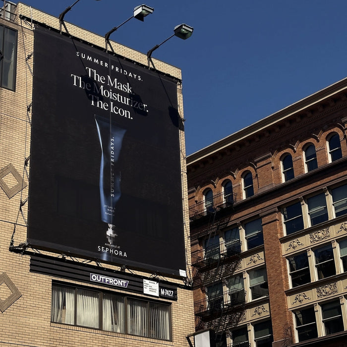 Sephora advertisement on a building facade with clear blue sky