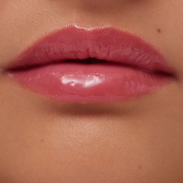 Close-up of glossy pink lips