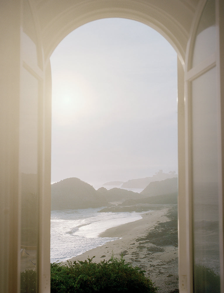 Ocean with beach view out of a window