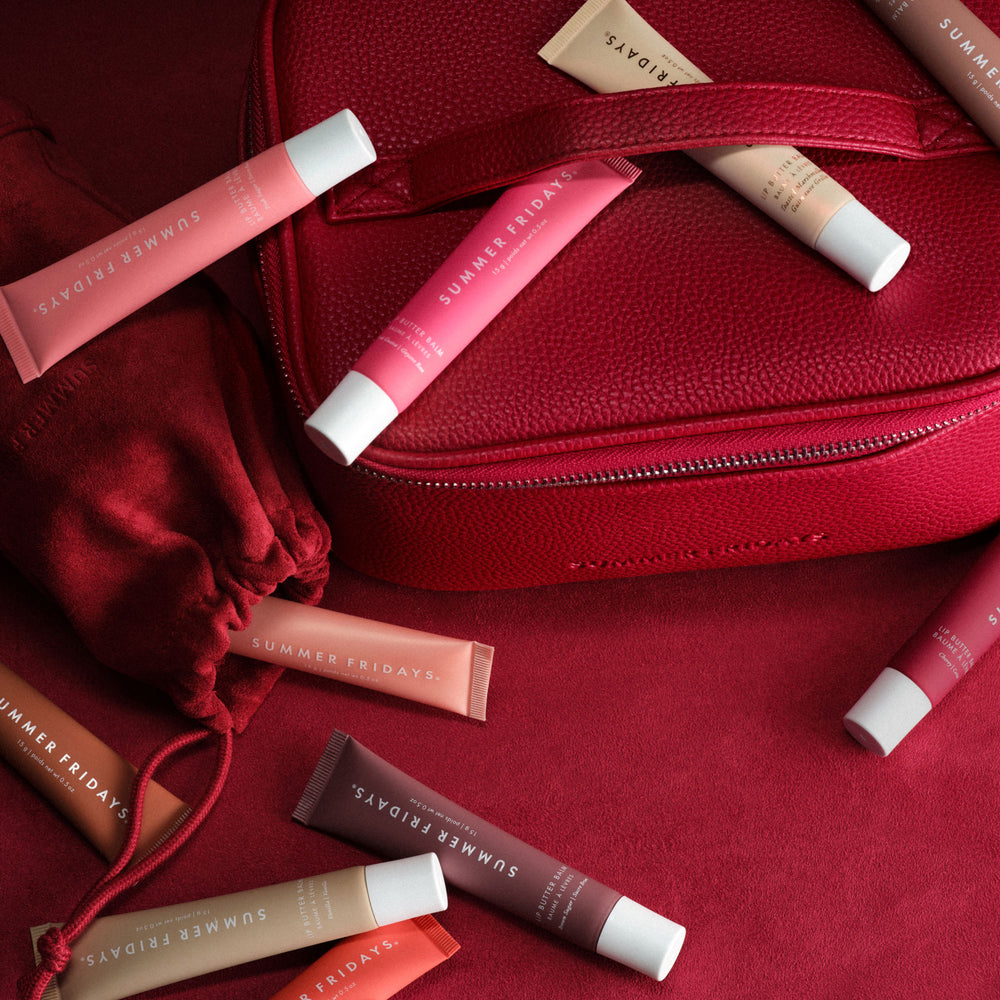 Lip balm tubes with a red case on a red background
