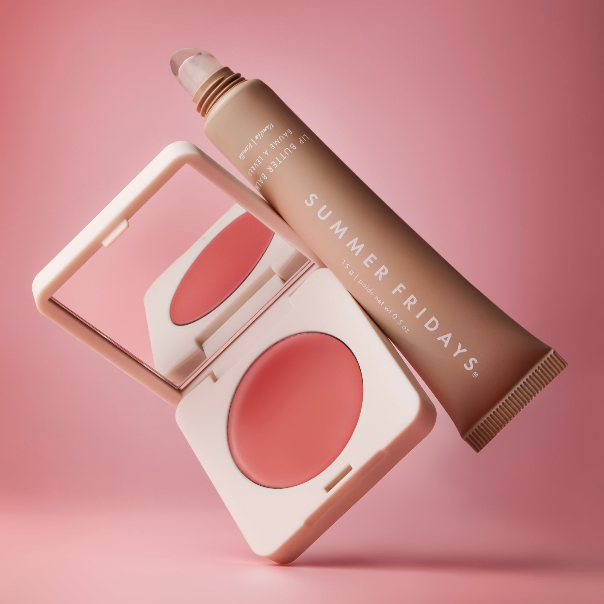 Makeup products including a blush and a tube of cream on a pink background with 'Summer Fridays' branding.