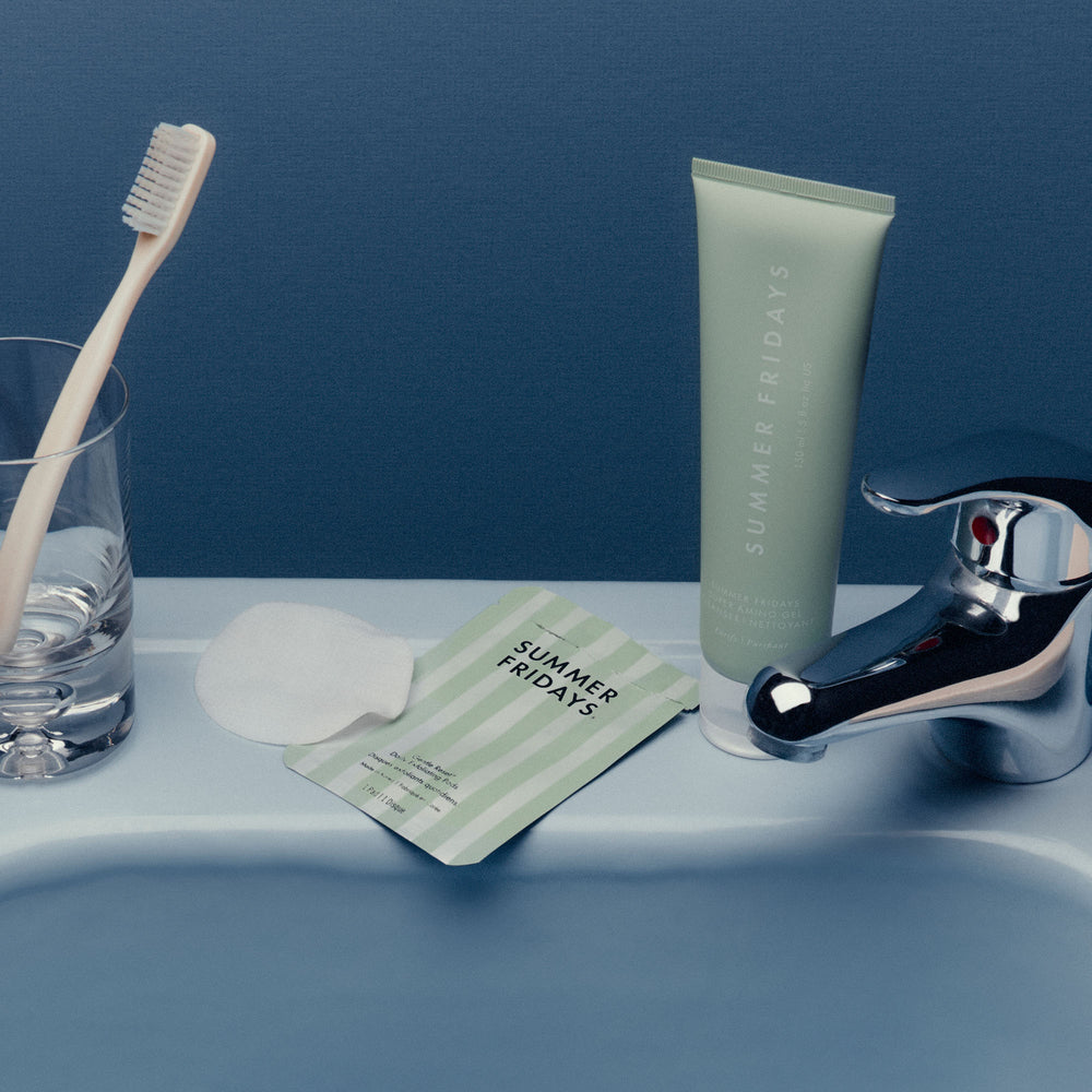 Bathroom setting with 'Summer Fridays' skincare products on a sink.