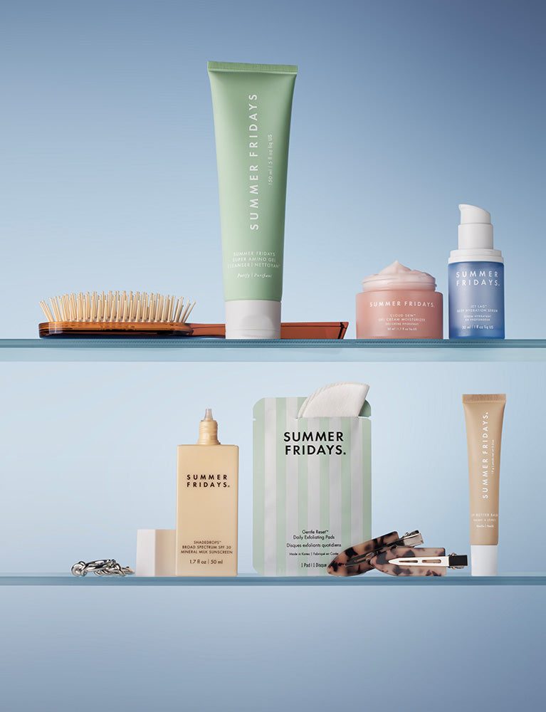 Collection of Summer Fridays skincare products on a shelf with a blue background