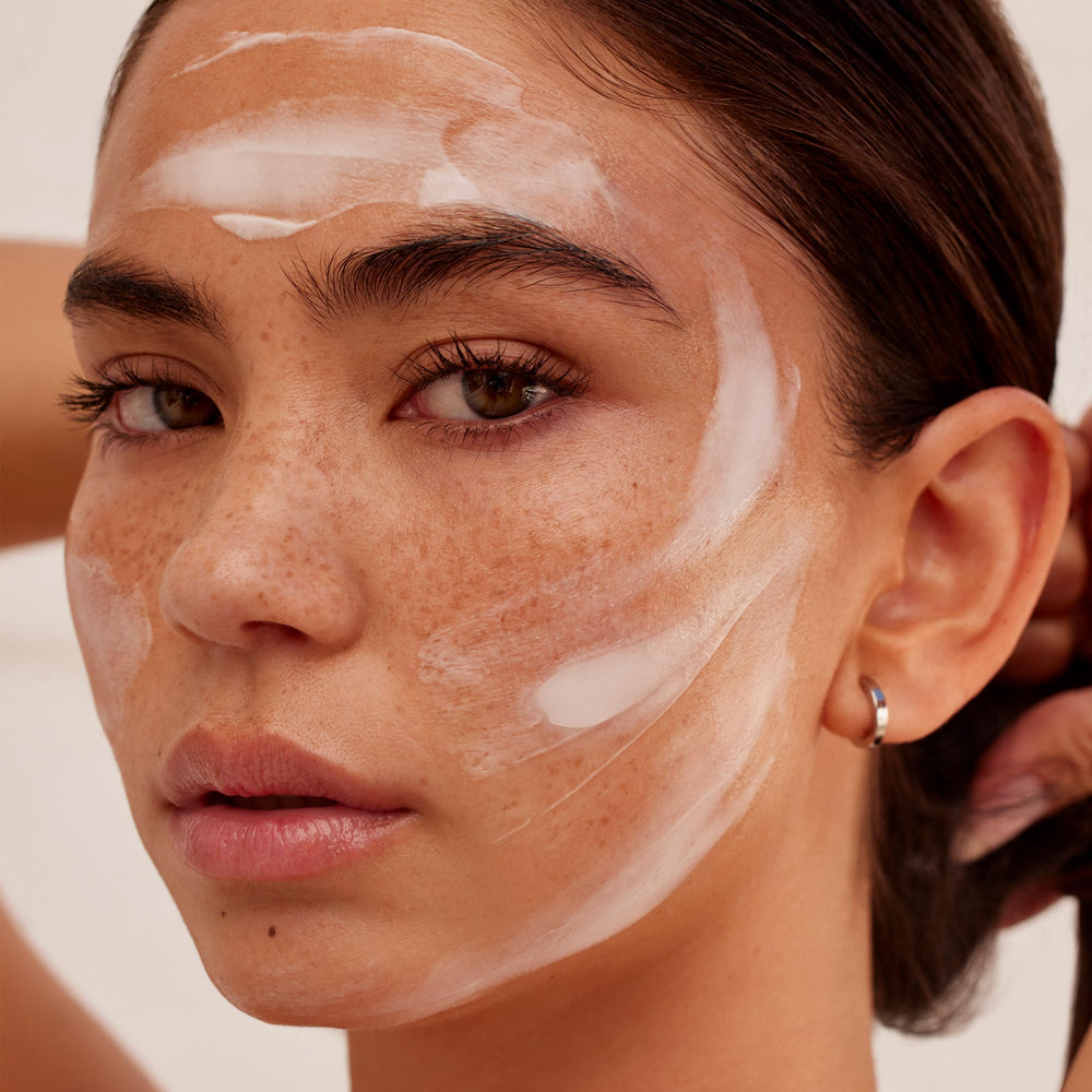 A woman with Jet Lag Mask applied to her face