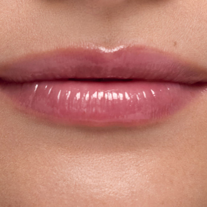 Close-up of glossy pink lips