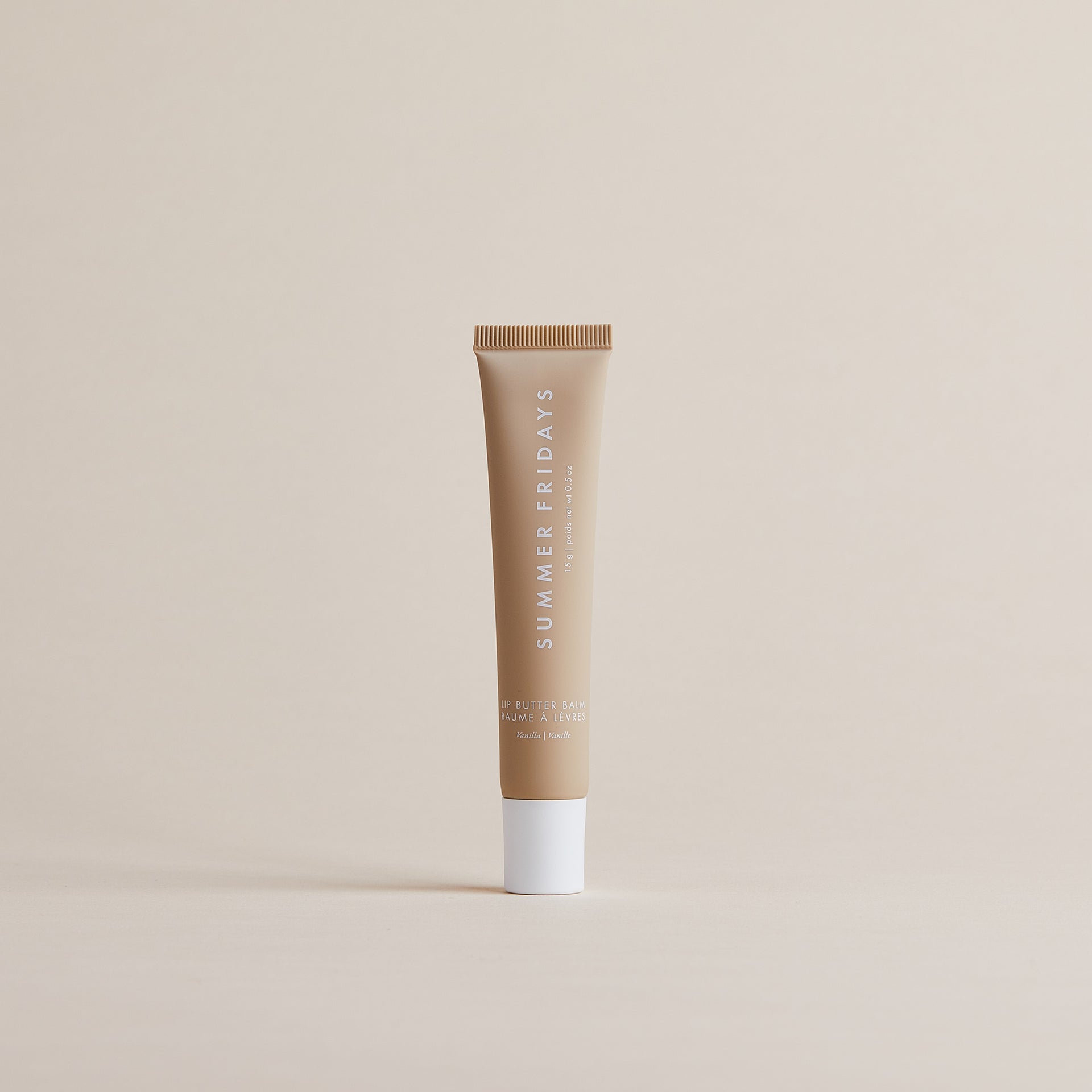 A tube of Summer Fridays Lip Butter Balm, with its signature minimalist packaging.